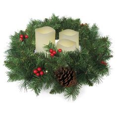 christmas wreath with candles and decorations on white background