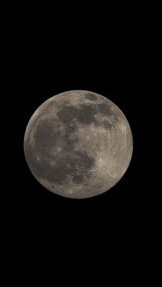 the full moon is seen in the dark sky with no clouds on it's side