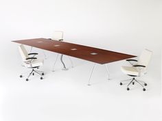 an office table with two chairs next to it