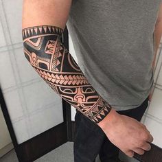 a man with a tattoo on his arm