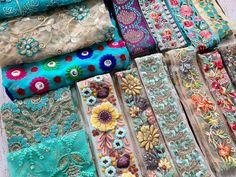 many different types of fabric are laid out on the floor