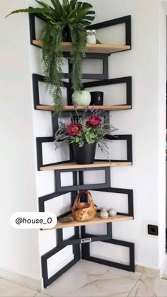 a corner shelf with potted plants on it