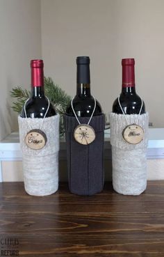 three bottles of wine are wrapped in burlocks