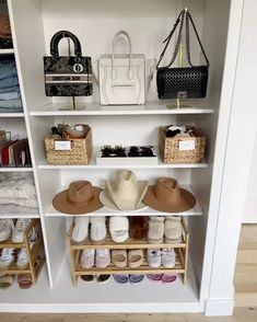 an organized closet with hats, purses and other items on shelving unit shelves