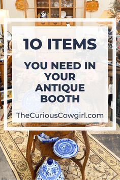 a blue and white vase sitting on top of a table in front of a sign that says how to create a beautiful antique booth