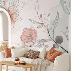 a living room with flowers painted on the wall