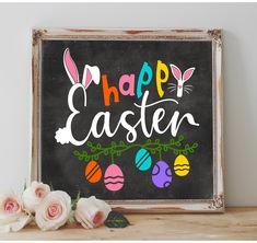 a chalkboard sign with the words happy easter painted on it and flowers in front