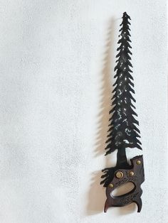 "Family Tree Handsaw: Unique, handmade, original handsaw cut into the shape of a tree. Saw will have a nail hole cut at the top for hanging. (Medallions vary per saw.) We supply the saw: $124.00 OR: Have a saw used by an important member of your family? Send us a saw that's important to you and let us create your \"Family Tree.\" (Can personalize saw -see dropdown options- by adding up to 3 initials.) : $144.00 Saws are created by Tony Vetter of Northwest Ohio who learned the arts of metal work and wood working from his father.  Orders are processed within 1-3 weeks. Based on time of year (i.e. holiday season) please plan for enough time to receive your items. Items will be shipped in size appropriate mailers via FedEx. Orders are custom made based on your need and there for are not eligib Recycled Metal Art, The Saw, Tree Saw, Steel Art, Christmas Gift Decorations, Welding Art, Metal Work, Saws, Recycled Metal