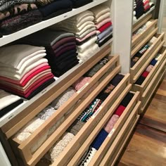 an organized closet filled with folded clothes