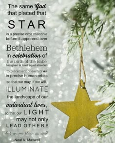 a christmas ornament hanging from a tree with the words, and an image of a