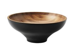 a wooden bowl sitting on top of a white table