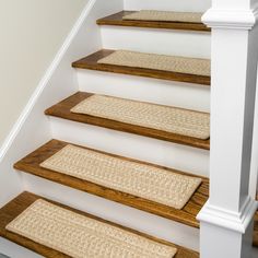 a set of stairs with rugs on them