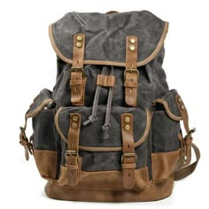 Vintage style waxed canvas backpack with fully adjustable shoulder straps. Main compartment can hold a tablet plus your other gear. Fold over front flap with snap fastening straps. Also an inner drawstring for extra security. Side and front pockets with flap closing and snap fasteners. This hardwearing backpack comes in various color options with contrasting tan or dark brown trims. Size: H 18" / 45cmW 13"/ 32cmD 6" / 15 cm Waxed Canvas Leather Backpack, Leather School Bag, Waxed Canvas Backpack, School Rucksack, Leather Backpack For Men, Laptop Shoulder Bag, Vintage Backpacks, Laptop Rucksack, Travel Bags For Women