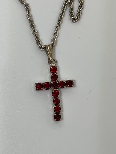 This is a silver tone costume jewelry red rhinestone cross pendant necklace. Comes with a silver tone 19 inch chain. No identifiable markings on chain or cross pendant that I can find. Materials unknown. Happy shopping! Red Cross Pendant Necklace Gift, Red Cross Pendant Necklace For Gift, In Remembrance Of Me, Angel Pin, Urn Pendant, Rhinestone Cross, Urn Necklaces, Memorial Necklace, Red Rhinestone