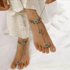 Do you like ghungroos in your anklets or payal? Then, it is the right time to buy these silver payal anklets with beads and dainty chains. This Indian jewelry is very skin-friendly and perfect for festivals, weddings, parties, and traditional occasions. You can gracefully pair a kurti, saree, or any Indo-western outfit to enhance your look with this silver Indian jewelry. The best part about these anklets is that they can be worn for a long period of time without any itching and swelling. Always Traditional Barefoot Sandals For Festivals And Parties, Beaded Toe Ring For Festivals, Traditional Beaded Barefoot Sandals For Party, Beaded Toe Ring Anklets For Festivals, Bohemian Beaded Toe Ring Jewelry, Beaded Toe Ring Barefoot Sandals As Gift, Beaded Toe Ring Barefoot Sandals For Gift, Handmade Anklets For Festivals And Parties, Bohemian Anklets For Wedding And Festivals