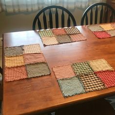 a wooden table topped with lots of place mats