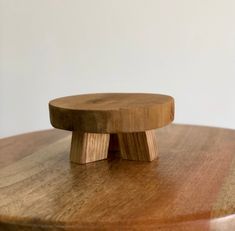 a wooden object sitting on top of a table