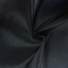 the black fabric is very soft and shiny, but it doesn't look like any other material