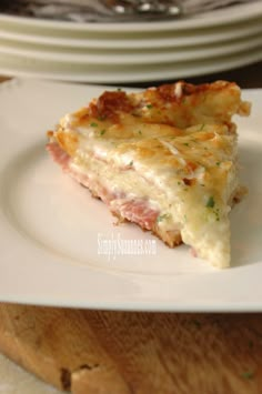 a slice of quiche on a white plate