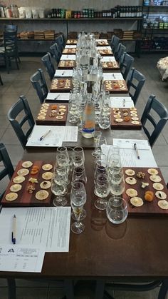 a long table with many glasses and plates on it