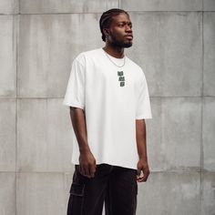 Master your urban look with an oversized t-shirt--a must-have streetwear piece. Crafted from heavyweight fabric, it offers unmatched comfort and durability. The relaxed fit ensures a cool, laid-back vibe. * Thick 100% cotton * Fabric weight: 6.5 oz./yd.² (220 g/m²) * Unisex style  * Oversized fit with drop shoulders * Ribbed collar * Blank product sourced from Bangladesh This product is made especially for you as soon as you place an order, which is why it takes us a bit longer to deliver it to Oversized Solid Sporty T-shirt, Oversized Solid Color Cotton T-shirt, Oversized White Sportswear T-shirt, White Breathable T-shirt For Streetwear, Oversized Organic Cotton T-shirt For Streetwear, Express Outfits, Urban Looks, T Shirt Oversized, Unisex Style