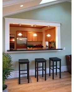 an instagram page with two stools in front of a kitchen island and bar