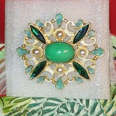 Where Do I Begin To Describe This Gorgeous Brooch!??! Gold Zinc Alloy Base With Designs Of White Faux Pearls, Navette Emerald Green Crystals, Aquamarine Opalescent Teardrop-Shaped Rainbow Crystals All Surround A Turquoise Retro-Blue Colored Resin Cabachon Center Bead. These Emerald Green Stones Have A Lot Of Blue In Them, (They Do Resemble A Blue Topaz) And It Really Gets Picked Up In The Light. A Great Color Combination In A Classy Brooch, Like The Style Of 18th Century. No Discounts On Single- Elegant Green Jeweled Brooches, Green Jeweled Brooch Gift, Green Jeweled Brooches For Gifts, Green Costume Jewelry Brooches For Gifting, Green Costume Jewelry Brooches For Gift, Crystals Aquamarine, Emerald Green Stone, Hat Brooch, Vintage Rhinestone Brooch