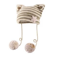 a knitted hat with two balls attached to the front and back of it's head