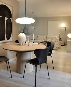 a dining room table with chairs around it