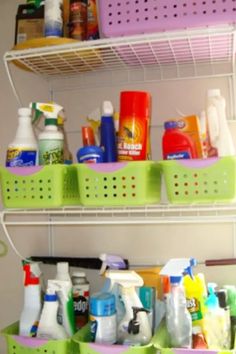 the shelves are filled with cleaning products and detergents in green baskets on them