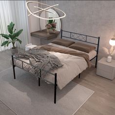 a bed sitting on top of a wooden floor next to a plant in a vase