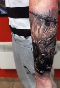 a man's arm with an airplane on it