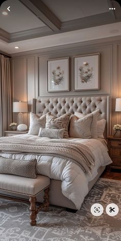 a large bed sitting in a bedroom next to two lamps on either side of it