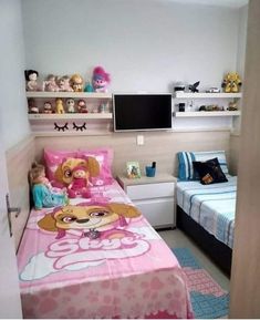 this is a bedroom with two beds and toys