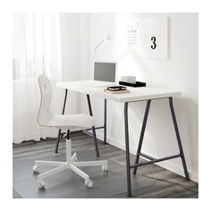 a white desk with a laptop on it and a chair next to it in front of a window