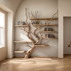 there is a tree with bookshelves in the corner and shelves on the wall