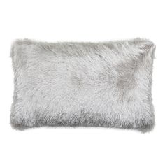 a gray furry pillow on a white background