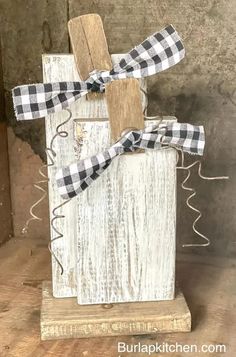 a wooden block with a black and white checkered ribbon tied around it