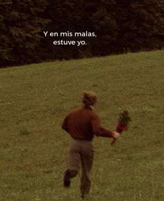 a man running across a lush green field