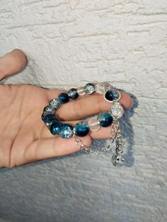 🌌✨ Discover the beauty of our Handmade Galaxy Bead Bracelet! 🌟  This elegant piece features stunning blue galaxy beads that create a mesmerizing space-themed look. 🌠 Handcrafted with care, this cosmic charm bracelet is designed to dazzle with its shimmering celestial stones.  🌟 Whether you're looking for a unique accessory or a fashionable cosmic bracelet, this eye-catching piece is perfect. 💫 Embrace the luxury of space jewelry and make a statement with our stylish celestial bracelet.  🌌💙 Elevate your style with this beautiful gemstone bracelet, featuring radiant blue charms and a starry design that's sure to turn heads. 🌠🔮 Don't miss out on this gorgeous, handmade galaxy bracelet that blends cosmic allure with chic elegance! 🌟🌌 Blue Crystal Bracelet With Colorful Beads, Blue Crystal Bracelet With Faceted Beads, Celestial Blue Beaded Jewelry, Celestial Style Beaded Bracelets As Gift, Blue Crystal Jewelry With Colorful Beads, Handmade Celestial Beaded Bracelets With Round Beads, Blue Spacer Beads Bangle Jewelry, Blue Faceted Beads Bracelet, Blue Bangle With Spacer Beads