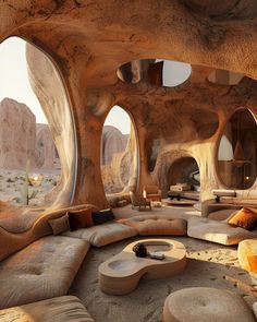 a living room with couches, tables and windows that look out onto the desert