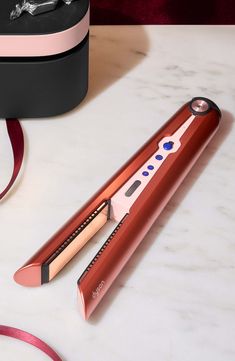 What it is: Special edition Dyson Corrale styler straightener in strawberry bronze and blush pink with complimentary Presentation case. What it does: An innovative cord-free styler and straightener with flexing plates that shape to gather hair, allowing for enhanced styling with less heat and half the damage.¹ It's cord-free with the thermal performance of a corded straightener. Go from curls and waves, to smooth and sleek with flexing plates. Intelligent heat control responds to the thickness, texture, and length of your hair and automatically controls the temperature for optimal styling results.Features and benefits:- Less heat, half the damage: flexing plates gather your hair for more control, so you can achieve the same style with less heat and 50% less breakage.¹- Up to 30 minutes cor Dyson Straightener, Dyson Corrale Straightener, Straightener Curls, Dyson Corrale, Hair Dryer Straightener, Dyson Hair Dryer, Hair Iron, Mom Christmas, November 11