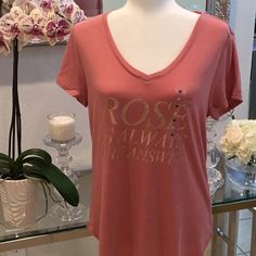 Super Soft Short Sleeve T-Shirt With Gold Lettering That Says Rose Is Always The Answer. This T-Shirt Is So Soft. I Have The Exact Same Shirt But In Small. This One Is A Medium. New With Tags And Has Never Been Worn. The T-Shirt Is A Little Bit On The Long Side. I Would Say It Kind Of Goes Past The Hips At Least On Me. I’m Not Very Tall. Gorgeous Dusty Rose Color. Gold Lettering. V-Neck. The Fabric Is Super Soft. And Rose Is Always The Answer For Everything!. Non-Smoking Household Fast Shipper Rose Print Tops For Summer, Summer Graphic Tee With Rose Print, Short Sleeve Rose Print Graphic Tee Tops, Casual Rose Print Tops In Rose Color, Casual Rose Print Tops, Casual Rose Cotton Top, Casual Pink T-shirt With Rose Print, Casual Pink Rose Print T-shirt, Rose Color Crew Neck Top With Rose Print