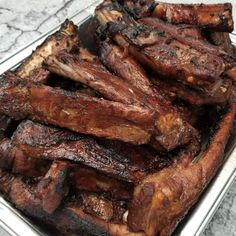 some meat is sitting in a pan on the table