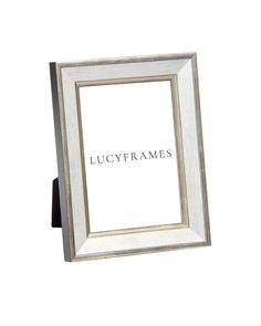 a white wooden frame with the word lucyframes in black lettering on it