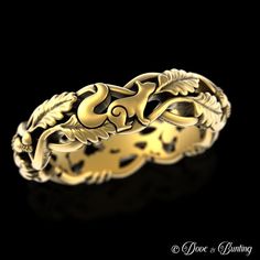 a gold ring with leaves on it