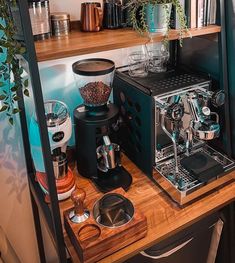 a coffee maker sitting on top of a wooden counter