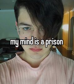 a man with glasses on his face and the caption reads, my mind is a prison