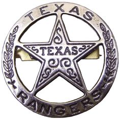 a silver and gold texas rangers badge