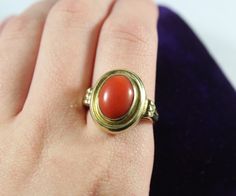 -Vintage 14k Gold Cabochon Natural Deep Red Orange Coral Ring -Ring size: 5.75 US -Coral size: 11.4 mm x 8.65 mm -Total weight: 4.3 g -Marked 585 Red Oval Cabochon Ring For Formal Occasions, Formal Red Domed Rings, Red Oval Cabochon Signet Ring For Formal Occasions, Formal Red Oval Cabochon Ring, Vintage Red Signet Ring, Vintage Yellow Gold Cabochons As Gift, Vintage Red Jewelry With Bezel Setting, Vintage Yellow Gold Cabochons For Gift, Heirloom Red Cabochon Ruby Ring